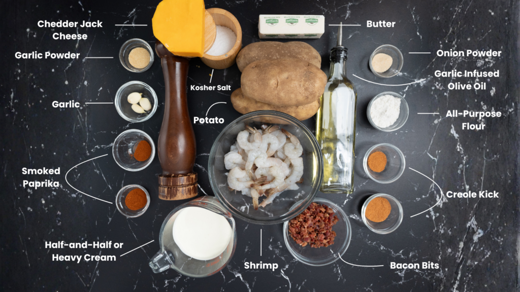 Top-down view of labeled ingredients for a cajun baked potato on a dark countertop—shrimp, potato, cheese, spices, milk, bacon bits, garlic, butter, olive oil—all arranged around a central bowl of shrimp.