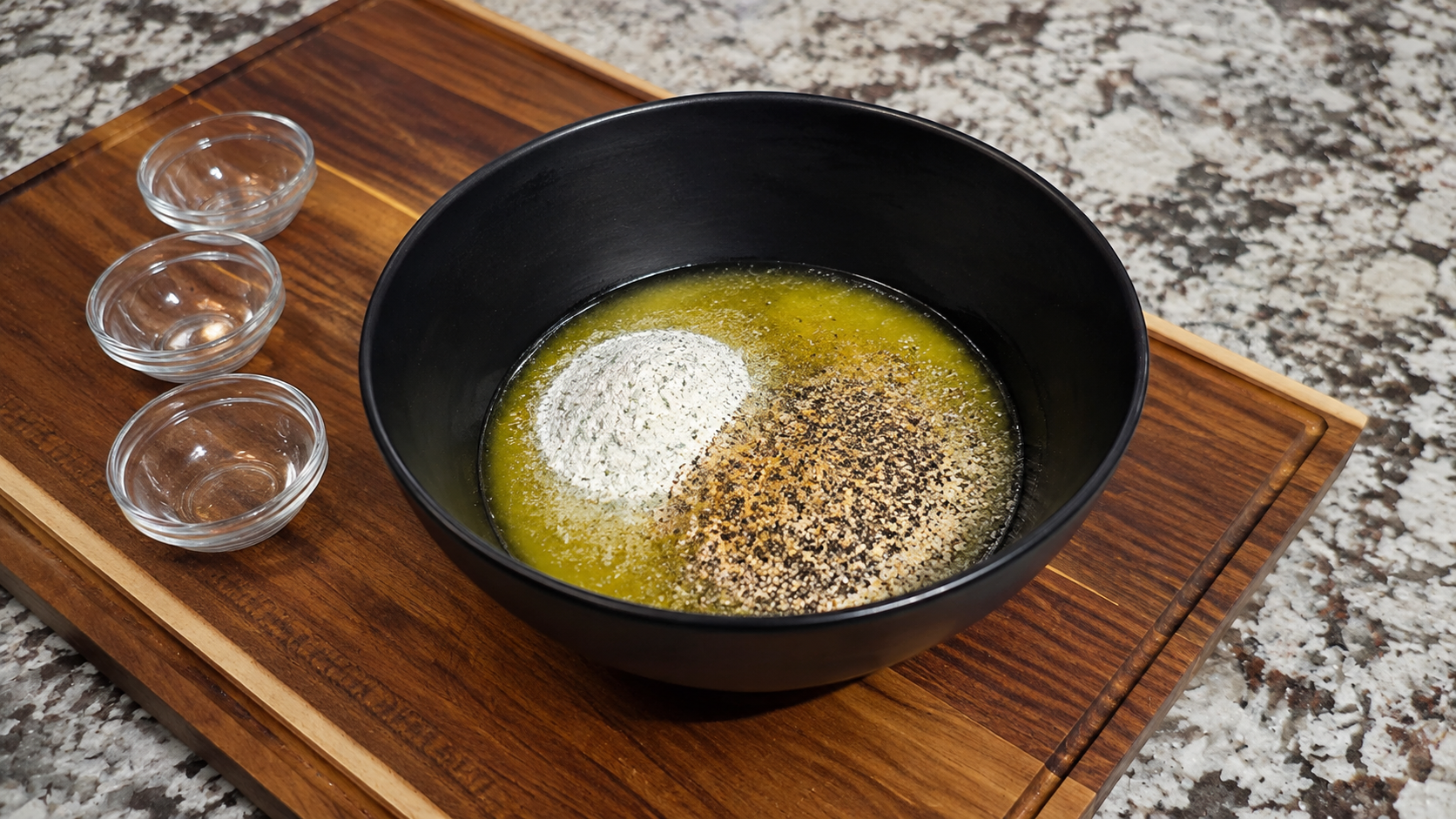 Melted butter with ranch seasoning and AB's SPG for hot honey ranch chicken legs.