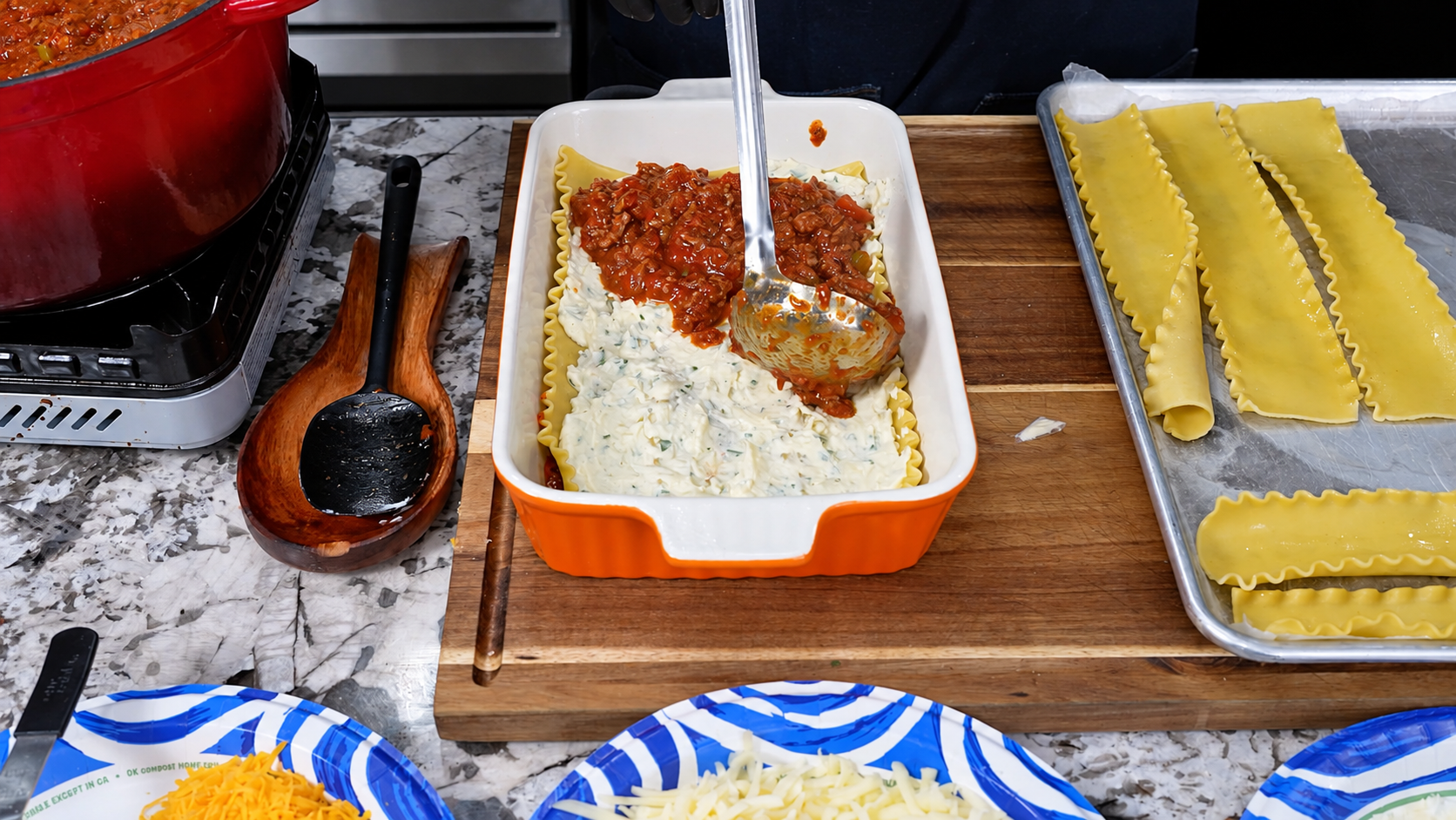 Thick beef and smoked sausage sauce spread over the ricotta layer.