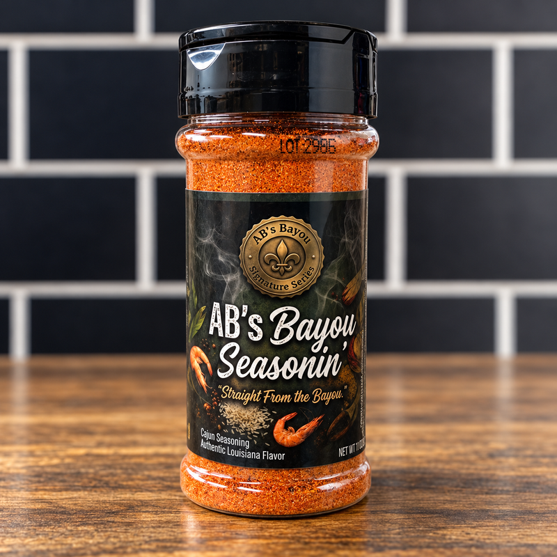 AB's Bayou Seasonin' bottle with its black label and orange-red seasoning.